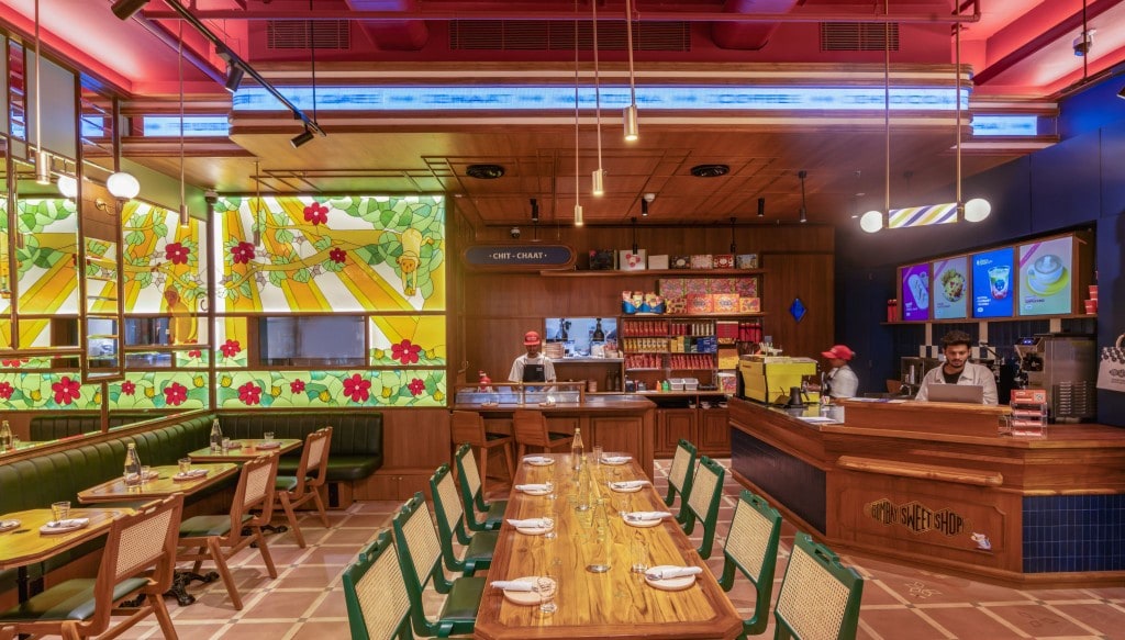 Cafe seating, service counter, and stained-glass feature wall