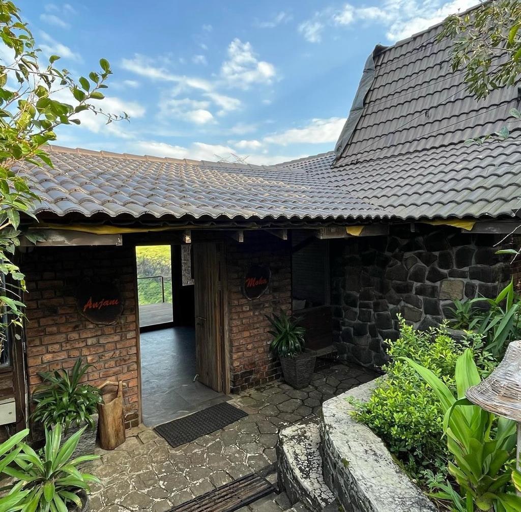 Anjani and Moka rustic brick and stone entrance